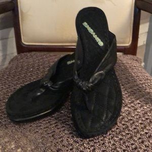 New black sandal with heel.  Like leather strap.